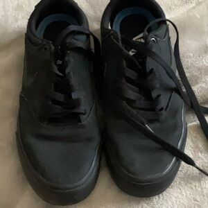 Nike Black Low-Top Sneakers with Lace-Up Design